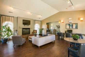 a living room filled with furniture and a fire place